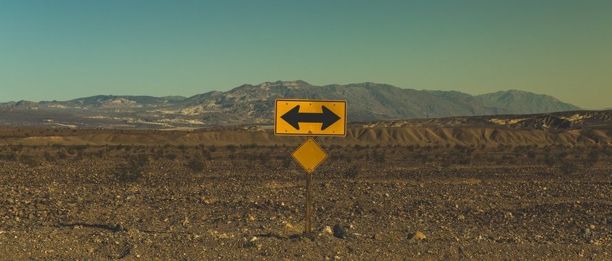 street sign with arrows