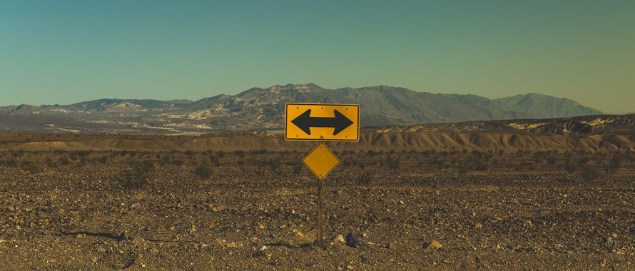 street sign with arrows